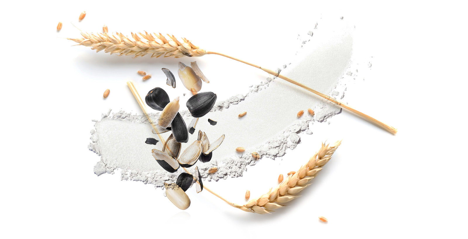 Hvedestrå og solsikkekerner på hvid baggrund, symbol på naturlige ingredienser.